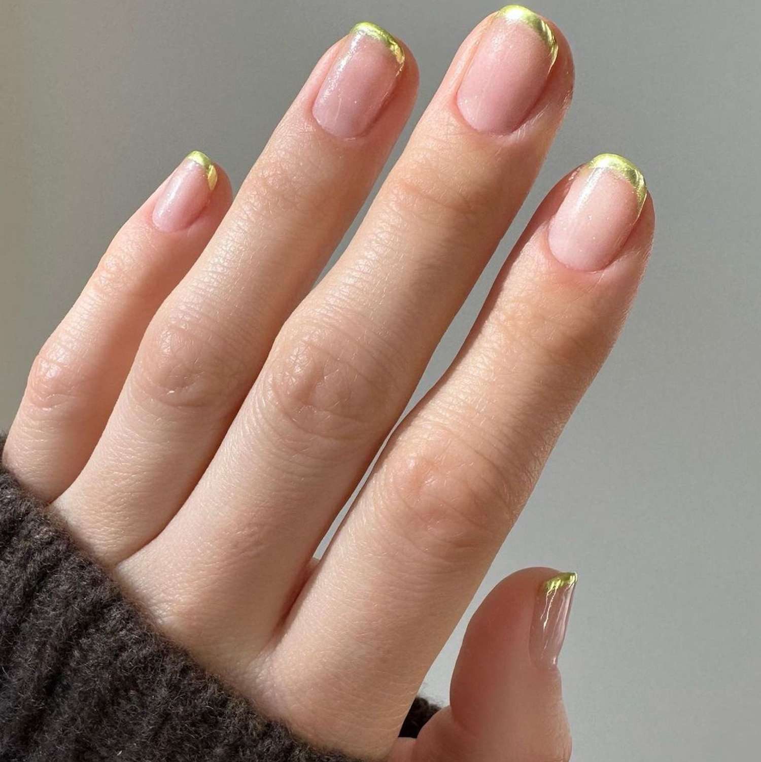 One Hand Close-Up Visual Idea — Short Gold French Tip Nails 2027