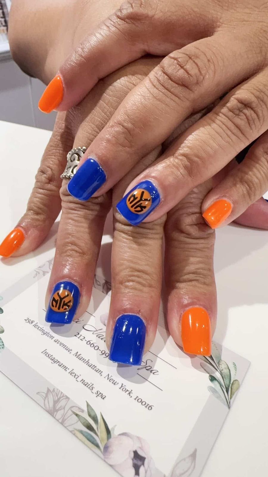 Team Logo Bright Orange and Royal Blue Team Logo Bright Orange and Royal Blue — Cheer Nails Team Colors 2027