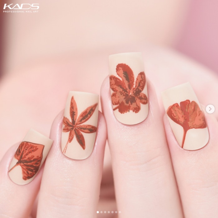 Matte Beige with Delicate Leaf Motifs — Simple Thanksgiving Nails 2026