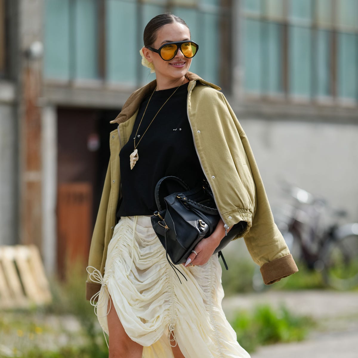 Olive Green Jacket with Ruched Cream Skirt and Yellow Sunglasses — Spring Outfits 2027 for Work