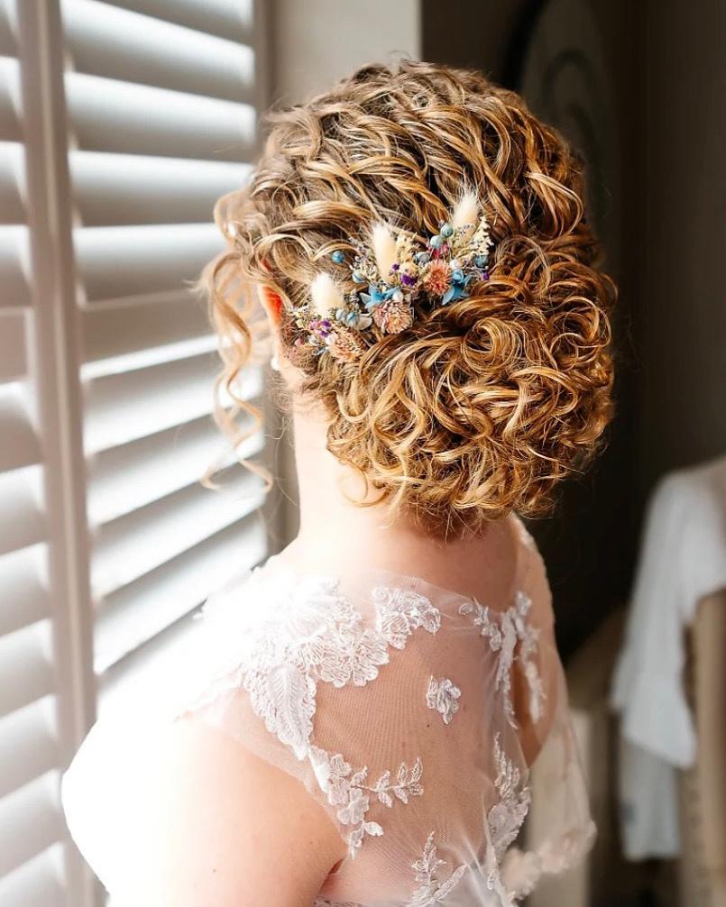 Curly Updo With Floral Accessory — Wedding Updos 2027