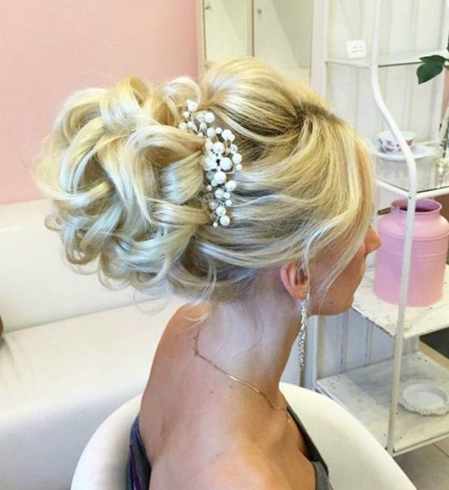 Low Bun with Braided Accents and Pins Low Bun with Braided Accents and Pins — Bun Hairstyles 2027