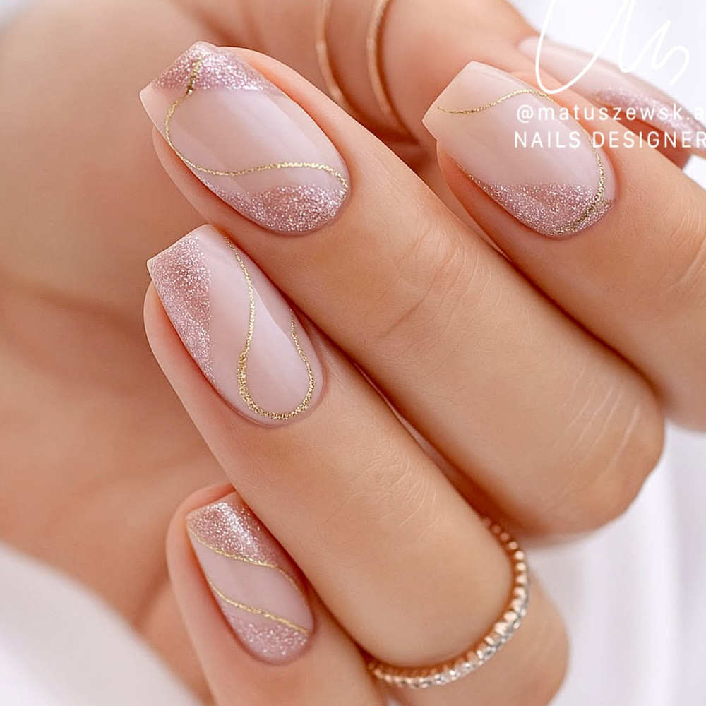 Nude with Gold Lines and Glitter French Nude with Gold Lines and Glitter French — Short New Years Nails 2027