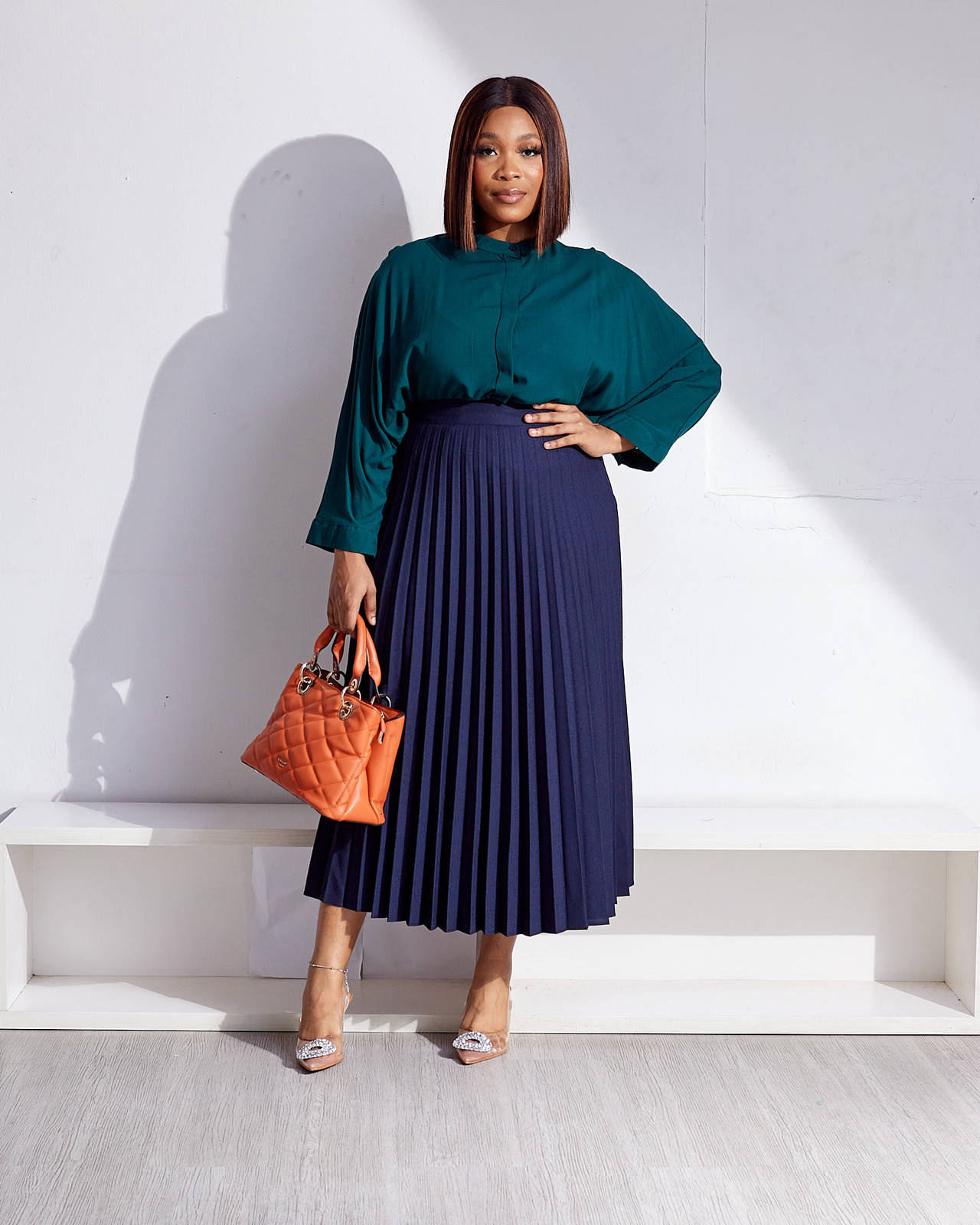 Pleated Midi Skirt with Teal Blouse and Orange Handbag Pleated Midi Skirt with Teal Blouse and Orange Handbag — Navy Blue Midi Skirt Outfits 2027