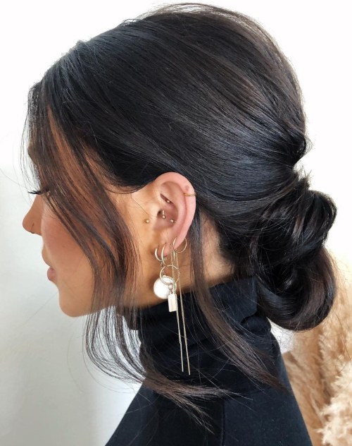 Low Messy Bun with Face-Framing Pieces Low Messy Bun with Face-Framing Pieces — Office Hairstyles 2027