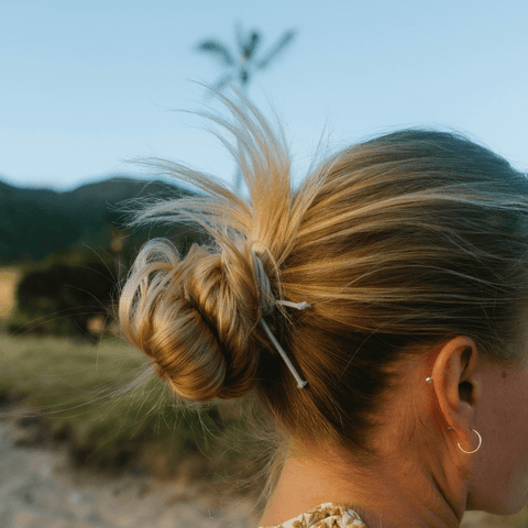 Messy Bun With Loose Strands Messy Bun With Loose Strands — Tennis Hairstyles 2027