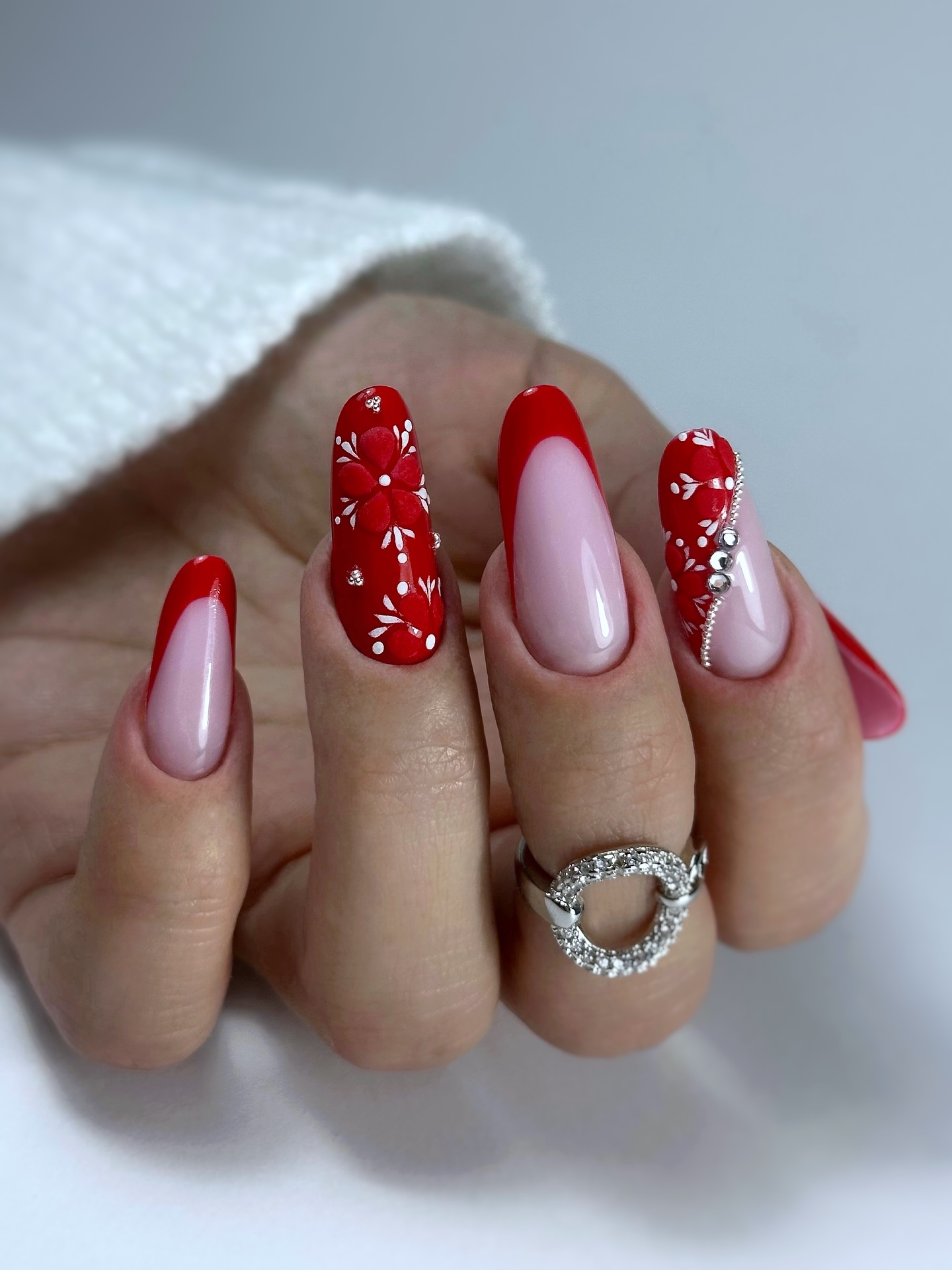 Red French Tips with Intricate White Art — Short Christmas Nails 2026