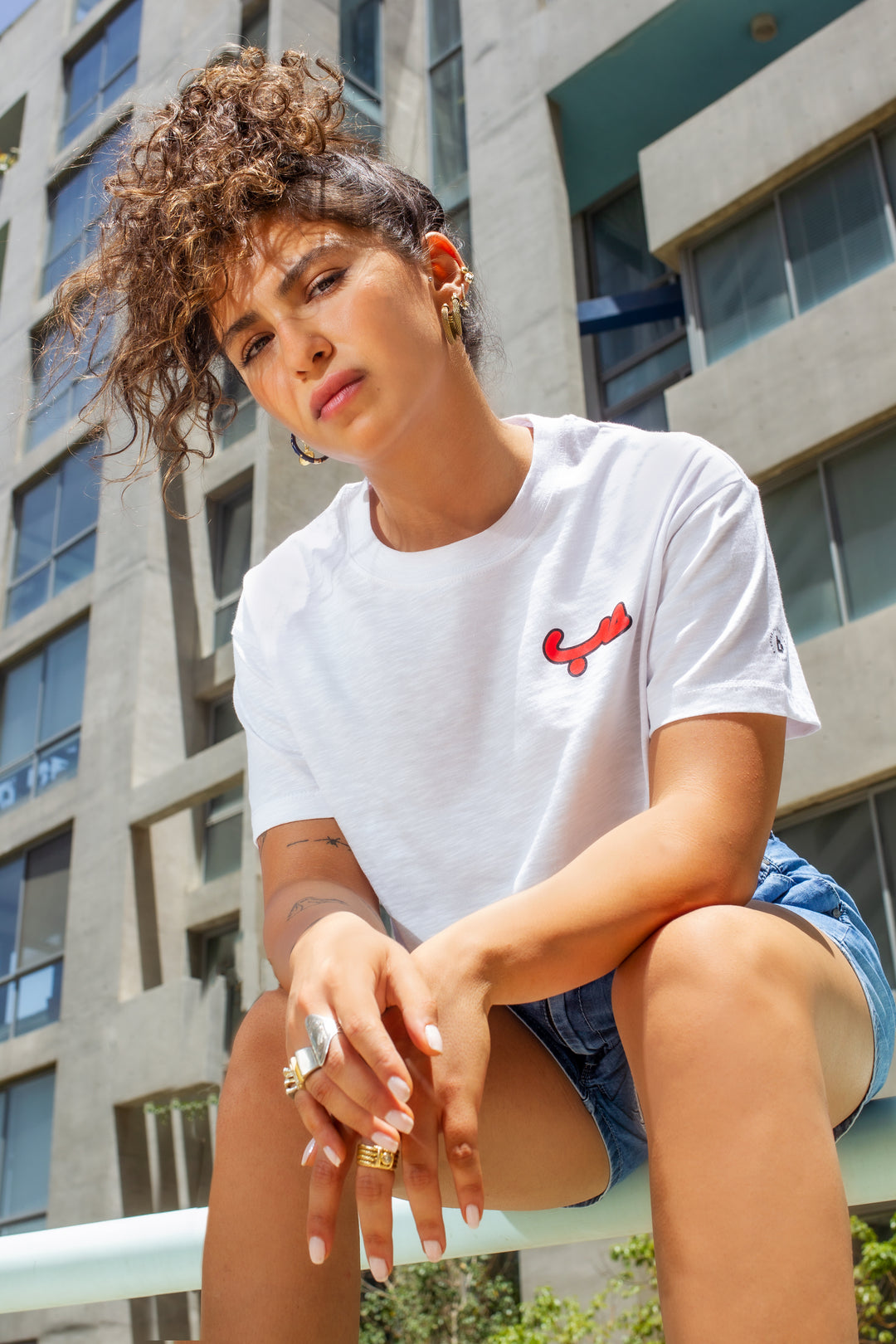 Close-Up on Distressed Denim and Minimalist Jewelry — Spring Denim Shorts Outfits 2027