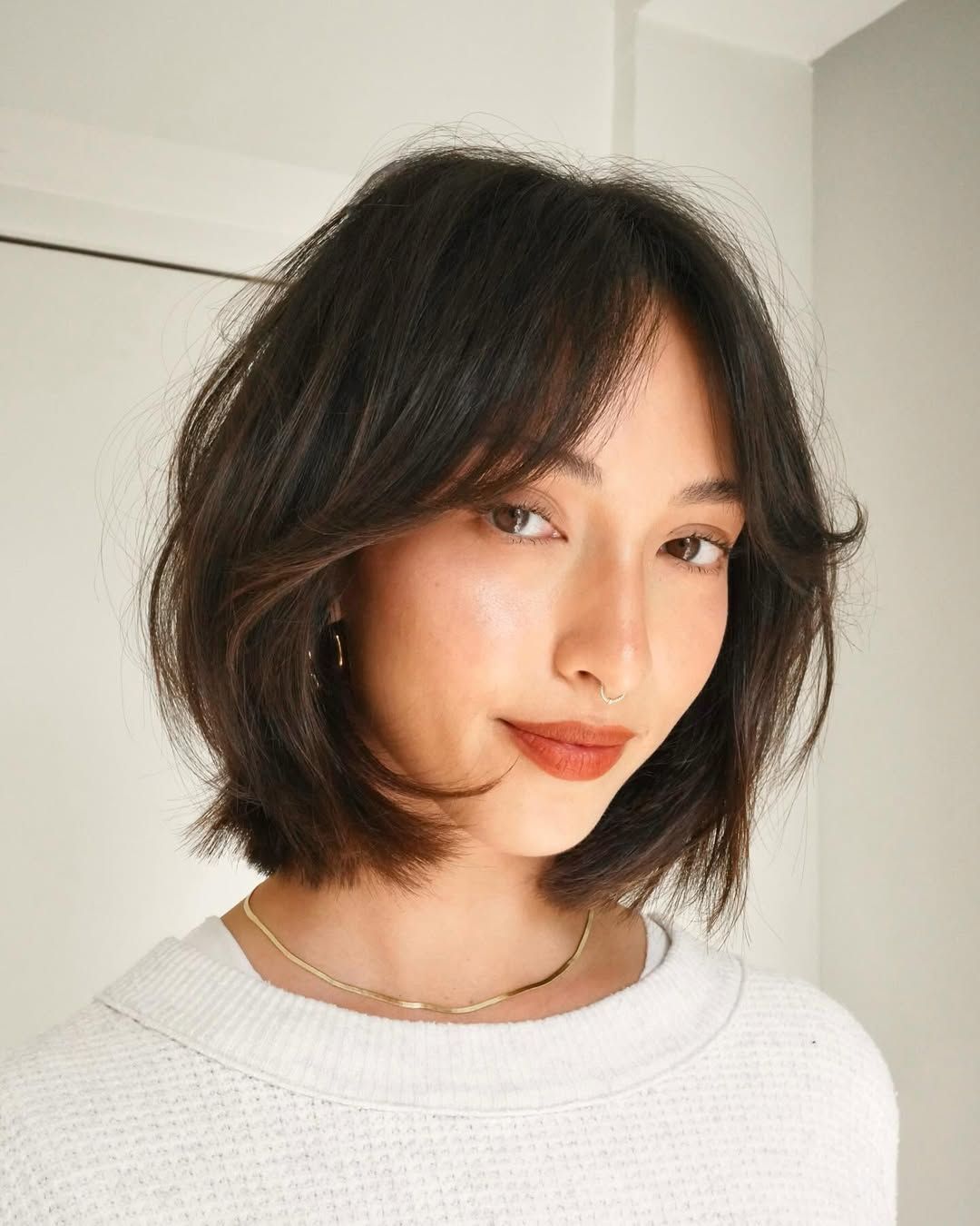 Textured Wavy Bob With Sweeping Bangs Textured Wavy Bob With Sweeping Bangs — Bob 2027 with Curtain Bangs