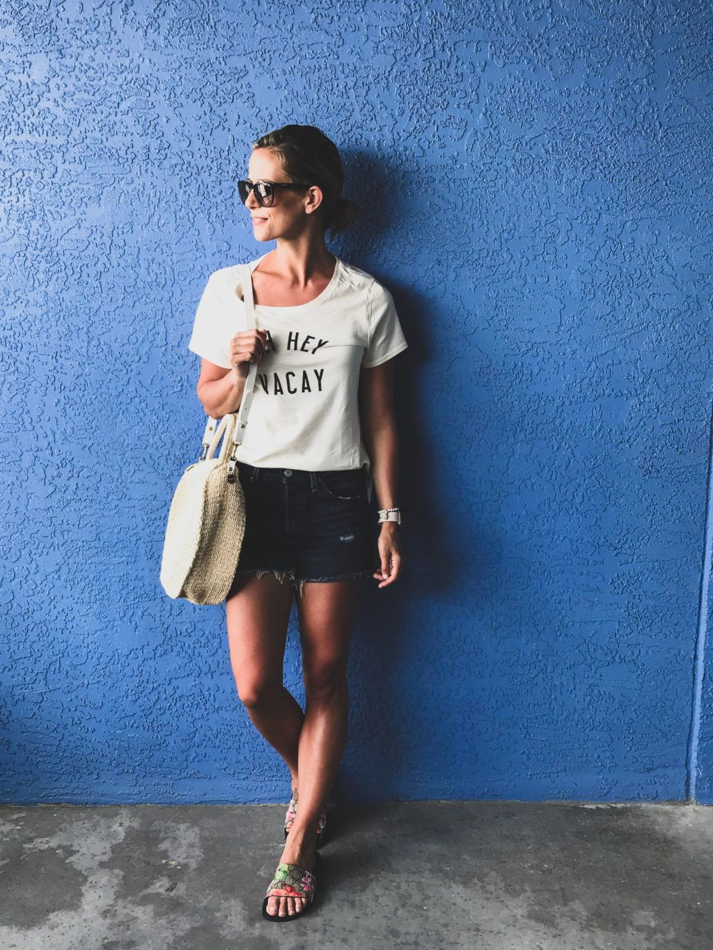 White Graphic T-Shirt Denim Shorts Outfit Idea White Graphic T-Shirt Denim Shorts Outfit Idea — Vacation Slides Outfits 2027