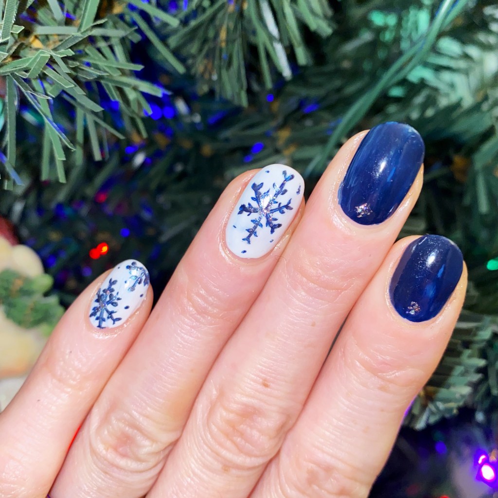 Deep Blue Snowflake Accent Oval Nails Deep Blue Snowflake Accent Oval Nails — Blue Christmas Nails 2026