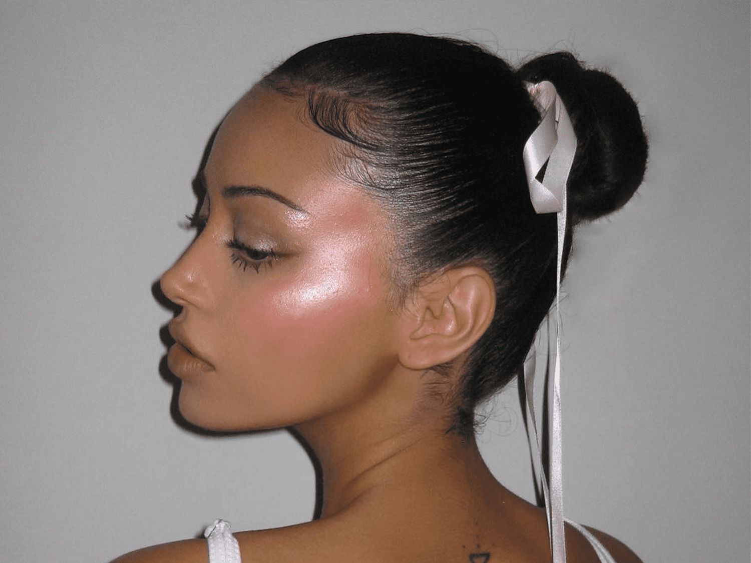 Sleek Low Bun With Trailing White Ribbon Sleek Low Bun With Trailing White Ribbon — Hair Bow Hairstyles 2027