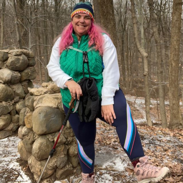 Striped Navy Leggings with Green Quilted Vest — Athletic Hiking Outfits 2027