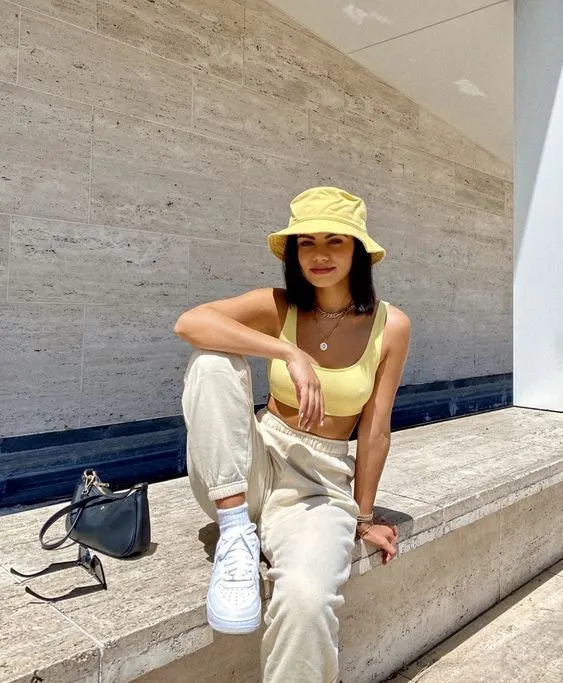 Chin Length Blunt Bob With Yellow Hat — Bucket Hat Hairstyles 2027