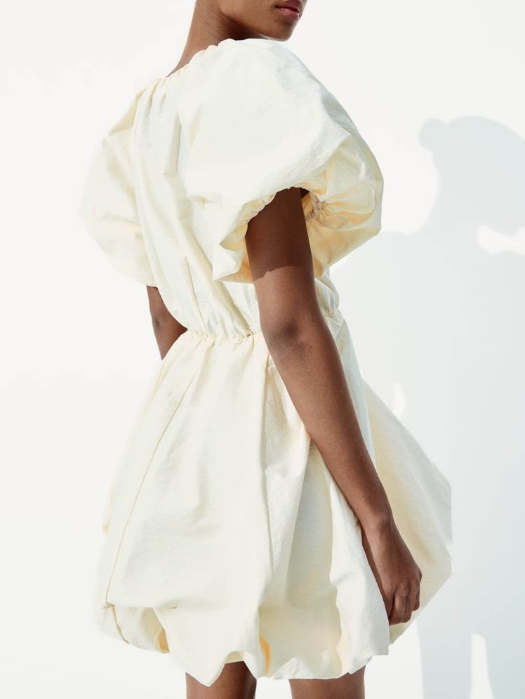 Oversized Puff Sleeves Define a Cream Nylon Bubble Dress Oversized Puff Sleeves Define a Cream Nylon Bubble Dress — Puff Sleeve Dress Outfits 2027