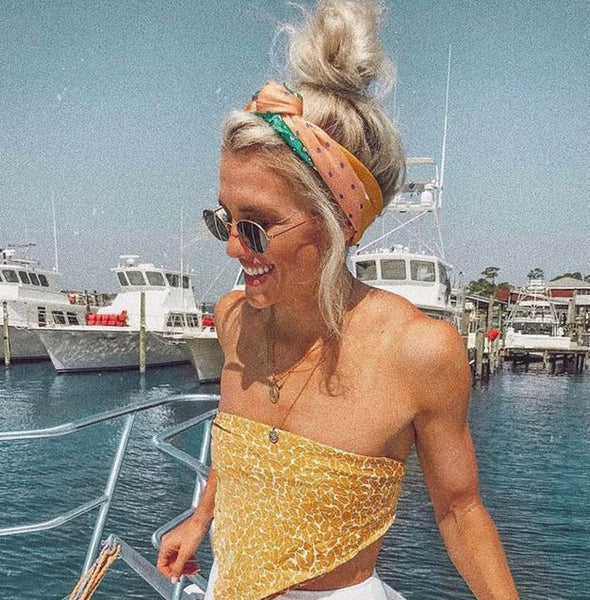 High Messy Bun With Scarf — Vacation Hairstyles 2027