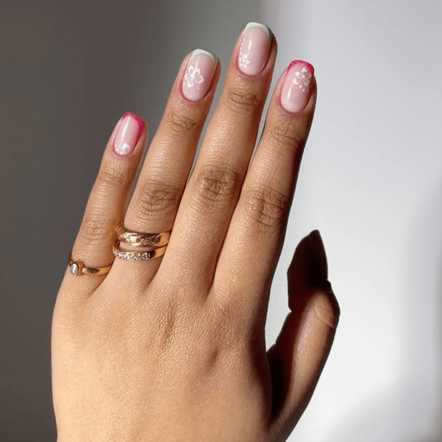Pink French Tips with White Floral Accents Pink French Tips with White Floral Accents — Short Pink French Tip Nails 2027