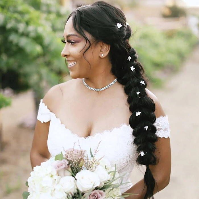 Dark Brown Fishtail Braid with Flowers Dark Brown Fishtail Braid with Flowers — Wedding Hairstyles 2027 with Weave