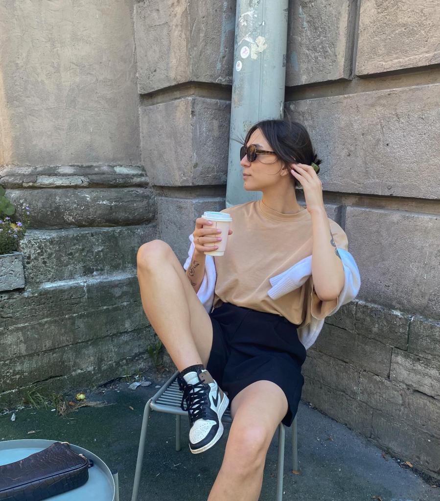 Black Tailored Shorts with Cardigan Draped Over Shoulders Black Tailored Shorts with Cardigan Draped Over Shoulders — Summer Outfits 2027 with Shorts