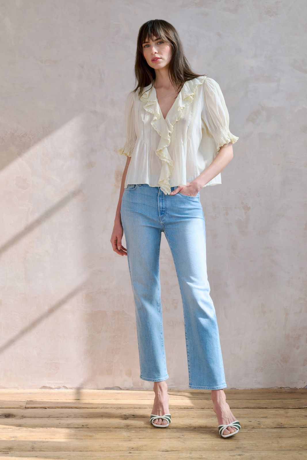 Casual White Ruffled Blouse with Light Blue Bootcut Jeans Casual White Ruffled Blouse with Light Blue Bootcut Jeans — Blue Bootcut Jeans Outfits 2027