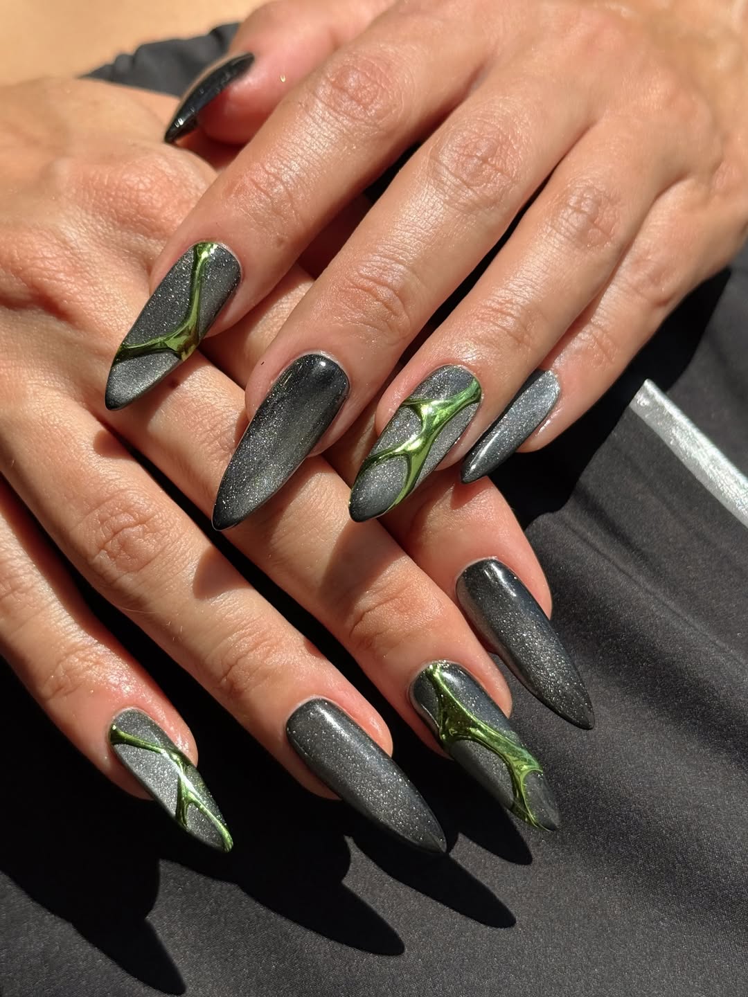 Charcoal Grey with Metallic Green Abstract Design Charcoal Grey with Metallic Green Abstract Design — Cat Eye Nails 2027