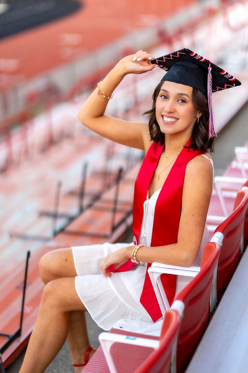White Tiered Dress with Red Sash for Graduation Photos — Graduation Speaker Outfits 2027