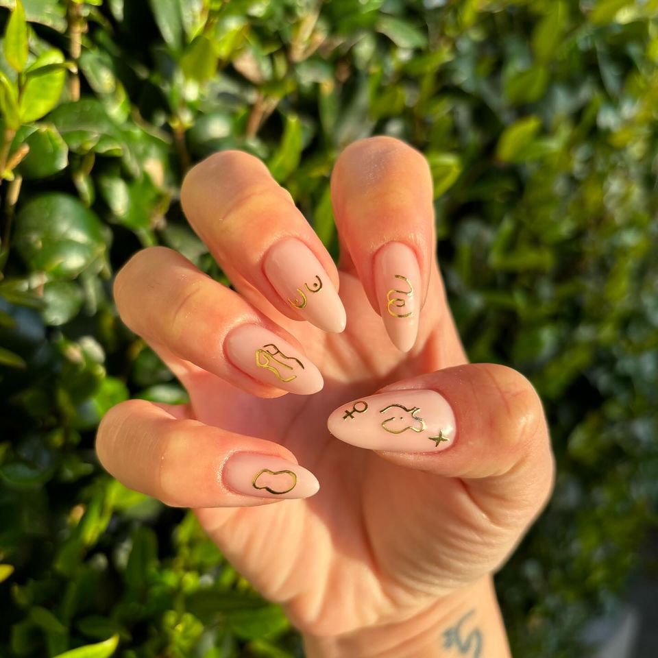 Nude Base with Gold Line Art Almonds Nude Base with Gold Line Art Almonds — Pastel Almond Nails 2027
