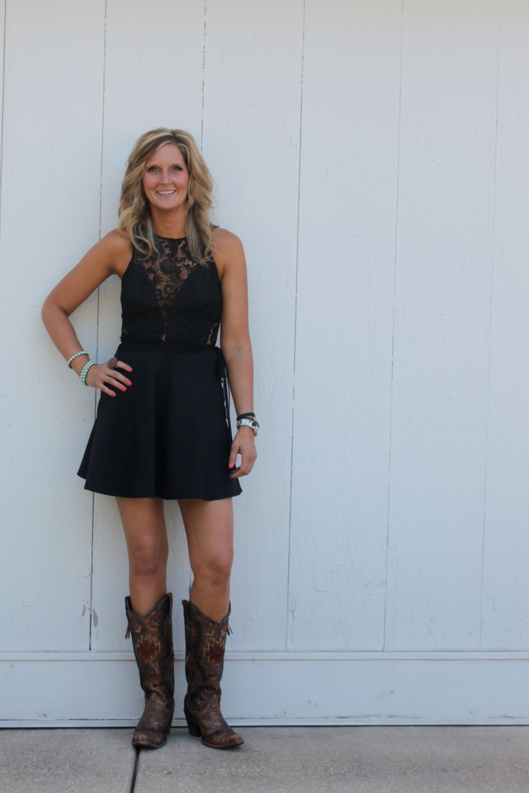 Black Lace-Trimmed Mini Dress with Cowboy Boots Black Lace-Trimmed Mini Dress with Cowboy Boots — Wedding Guest Outfits Barn 2027