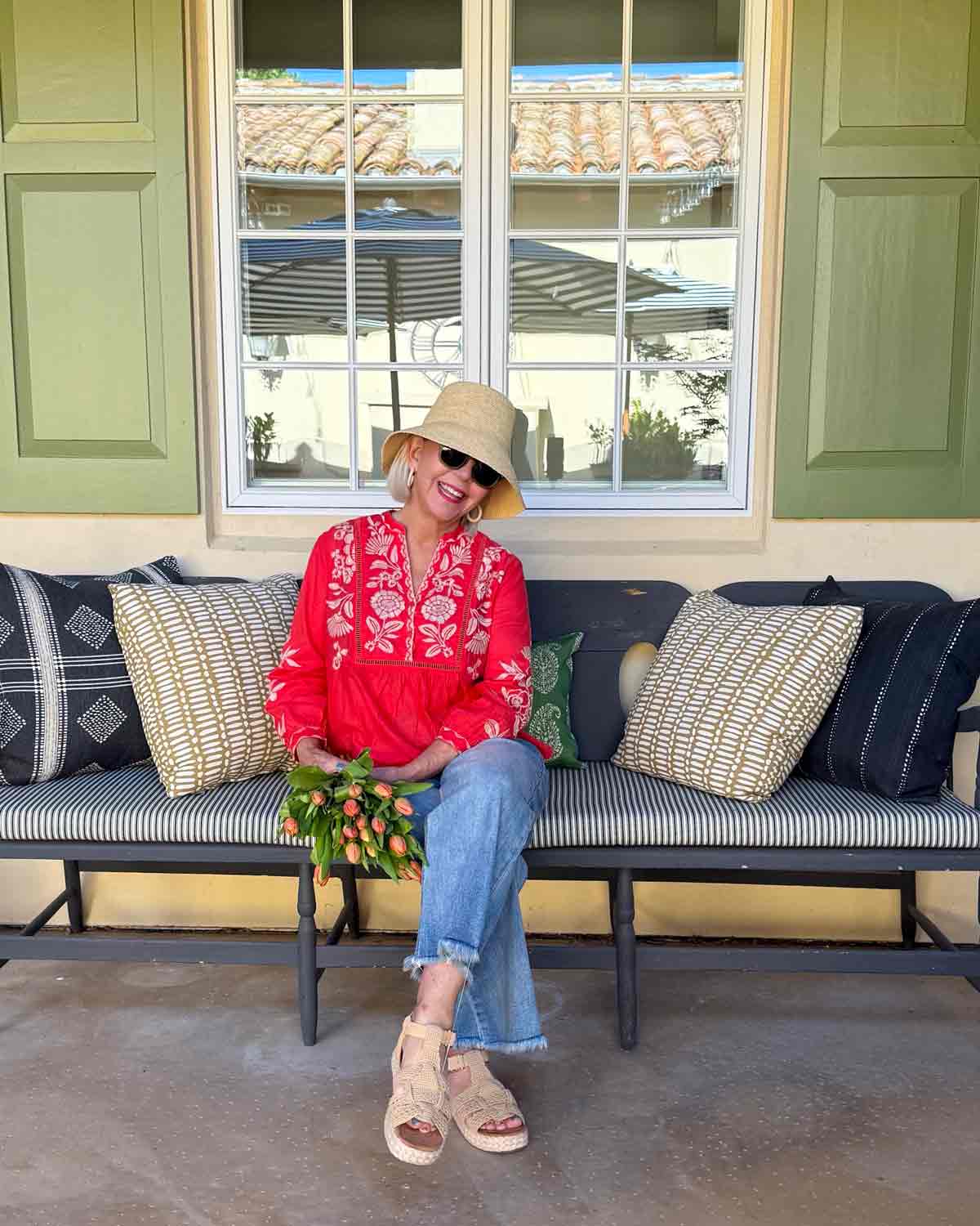 Raw-Hem Light Wash Jeans Worn with a Red Embroidered Peasant Blouse Raw-Hem Light Wash Jeans Worn with a Red Embroidered Peasant Blouse — Spring Outfits 2027 with Jeans