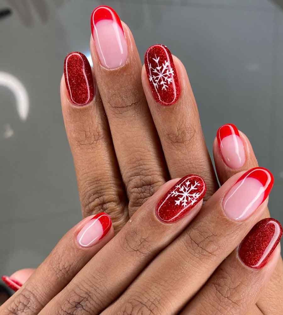 Festive Red Glitter and Snowflake Medium Oval Nails Festive Red Glitter and Snowflake Medium Oval Nails — Winter Nail Colors 2027 for Dark Skin