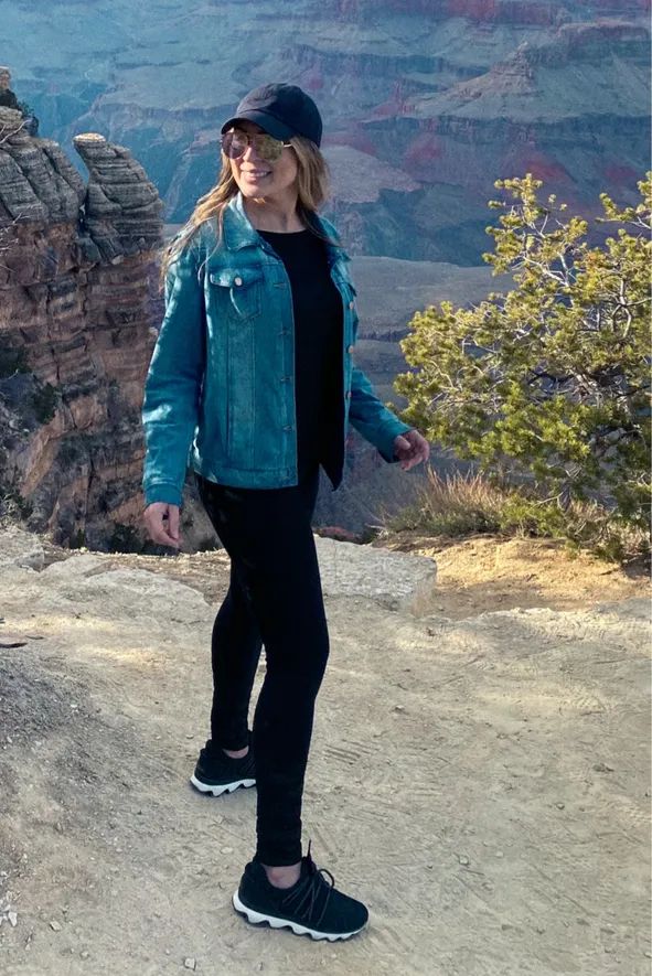 Teal Denim Jacket Layered Over Black Basics — Athletic Hiking Outfits 2027