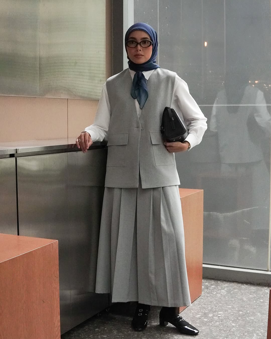 Smart Casual Sophistication: The Grey Vest and Pleated Skirt Ensemble Smart Casual Sophistication: The Grey Vest and Pleated Skirt Ensemble — Modest Outfits 2027