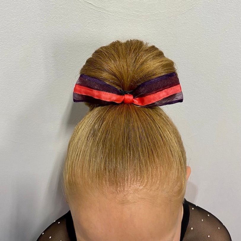 Sleek High Bun with Decorative Ribbon — Little Girl Gymnastics Hairstyles 2027
