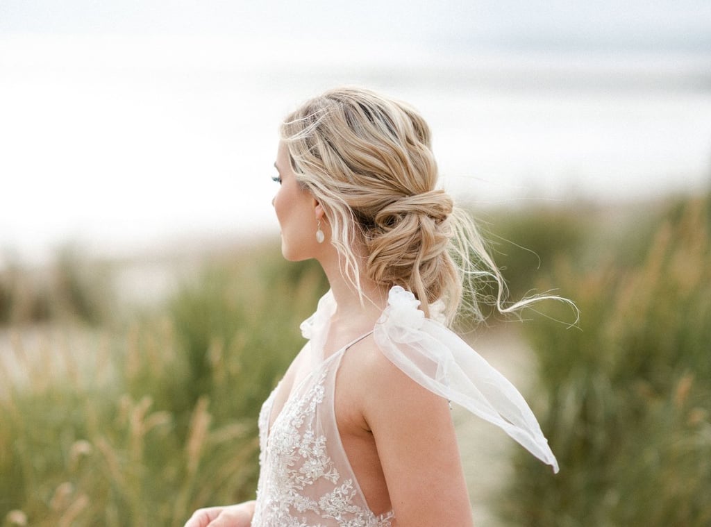 Low Messy Bun With Wispy Bangs — Wedding Updos 2027