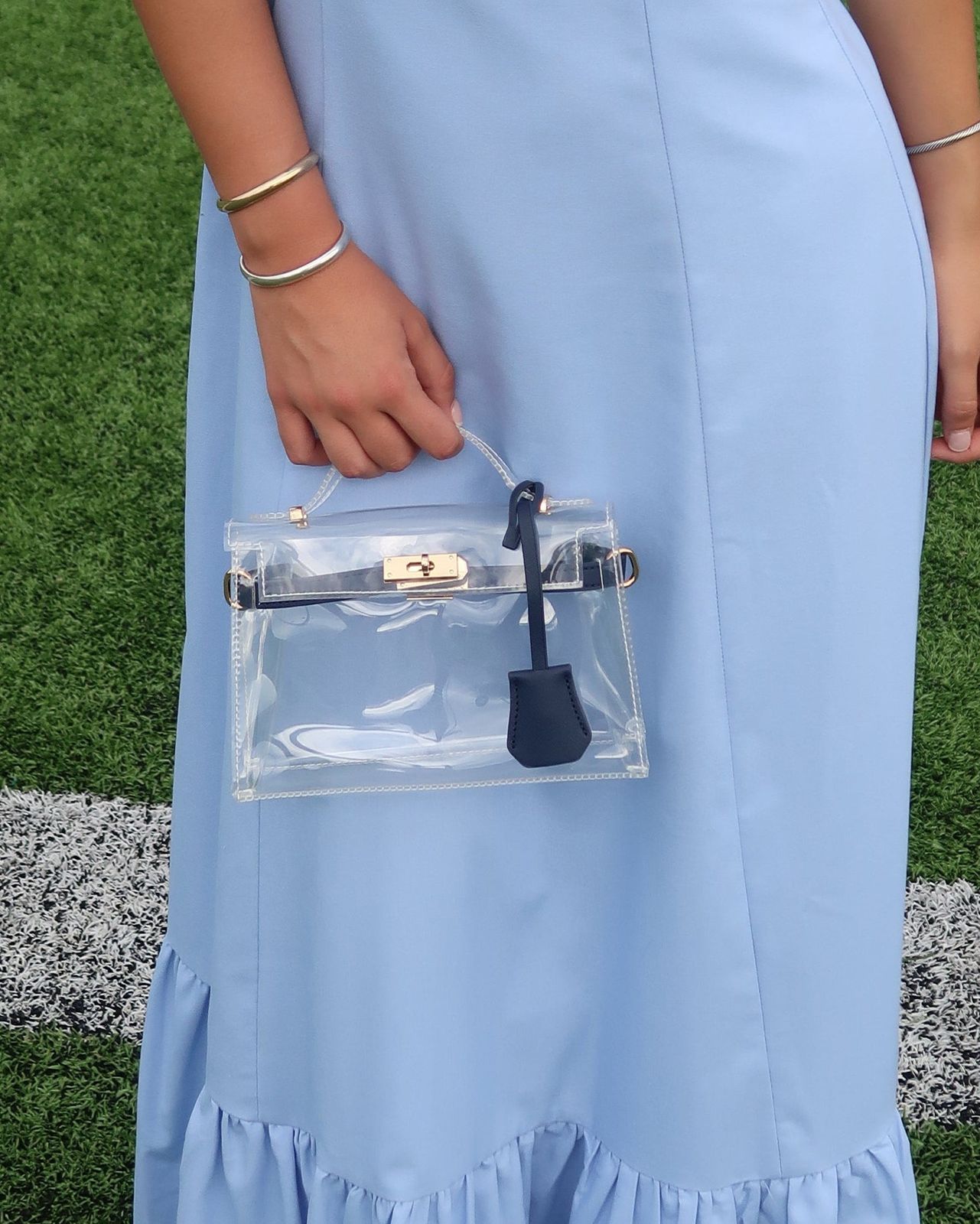 Ruffled A-line Dress with a Mini Clear Top-Handle Bag — Clear Bag Outfits 2027