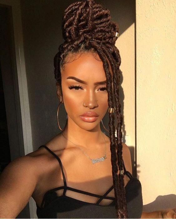 High Bun With Loose Face-Framing Strands High Bun With Loose Face-Framing Strands — Summer Locs Styles 2027