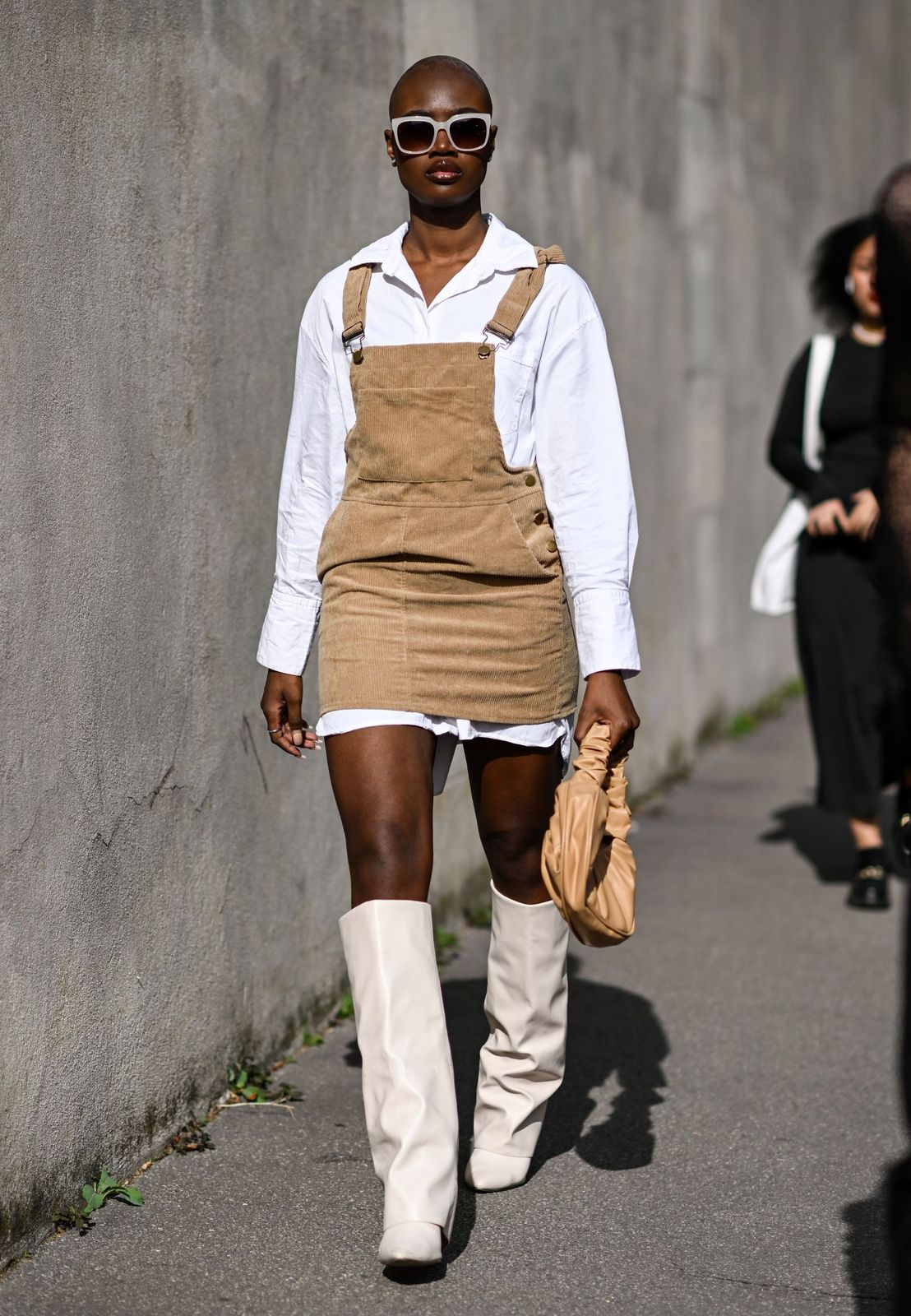 Tan Corduroy Pinafore Dress Over a White Shirt with Tall Cream Boots Tan Corduroy Pinafore Dress Over a White Shirt with Tall Cream Boots — Overalls 2027