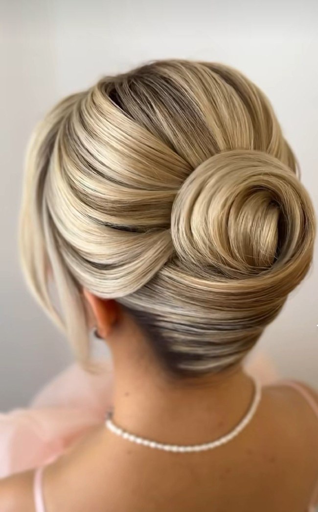 Structured Blonde Chignon With Dark Roots Structured Blonde Chignon With Dark Roots — Sleek Bun 2027