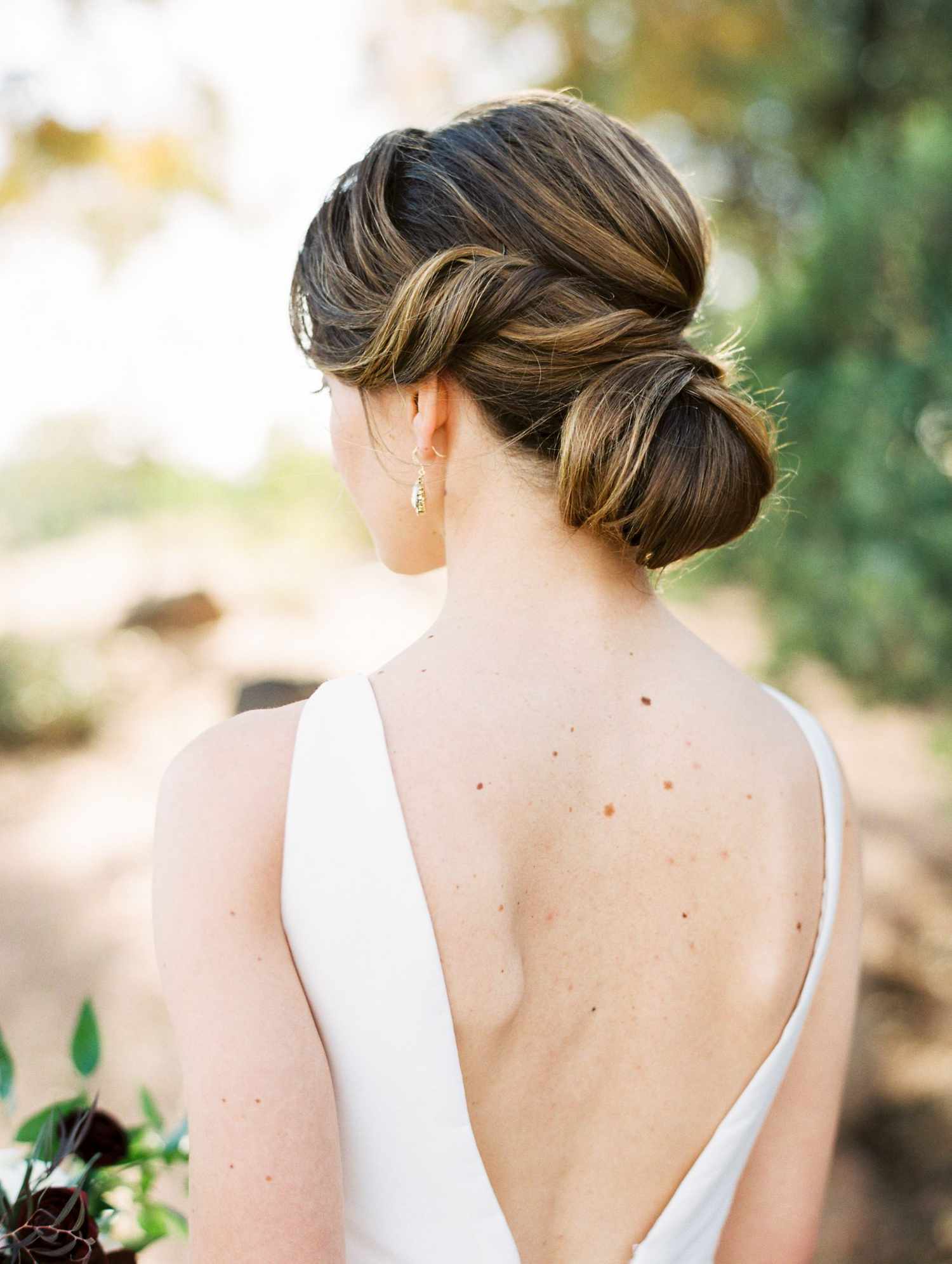 Messy High Bun with Curtain Bangs Messy High Bun with Curtain Bangs — Bun Hairstyles 2027