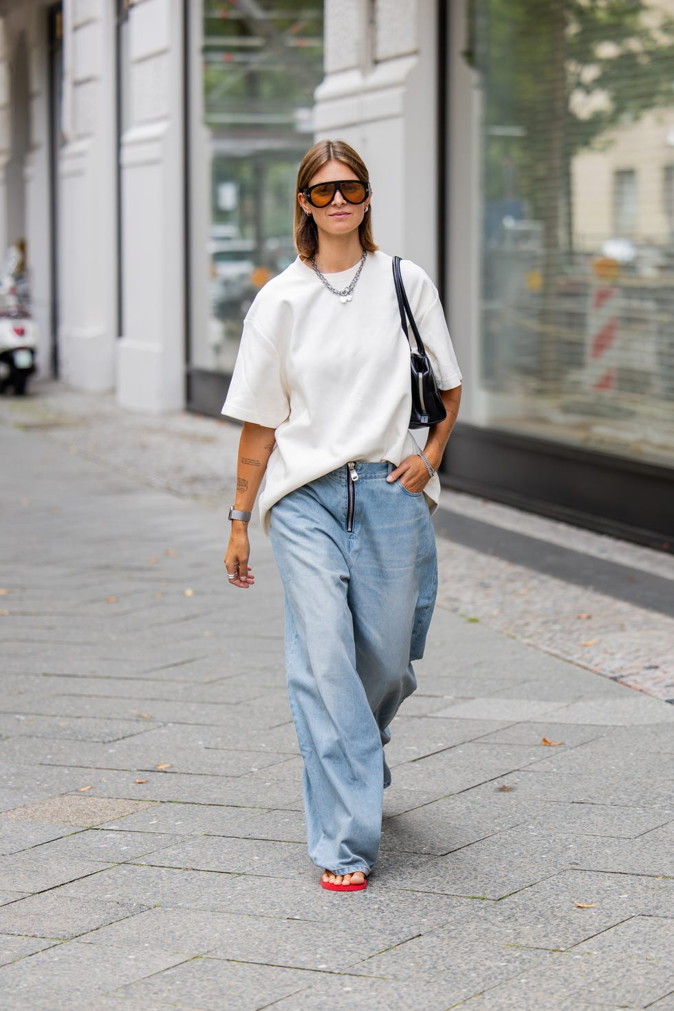 Oversized White Tee with Wide-Leg Jeans and Red Sandals — Oversized Shirt Outfits 2027