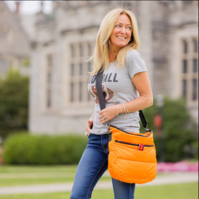 Sporty Orange Puffer Bag with Denim — Puffer Bag Outfits 2027