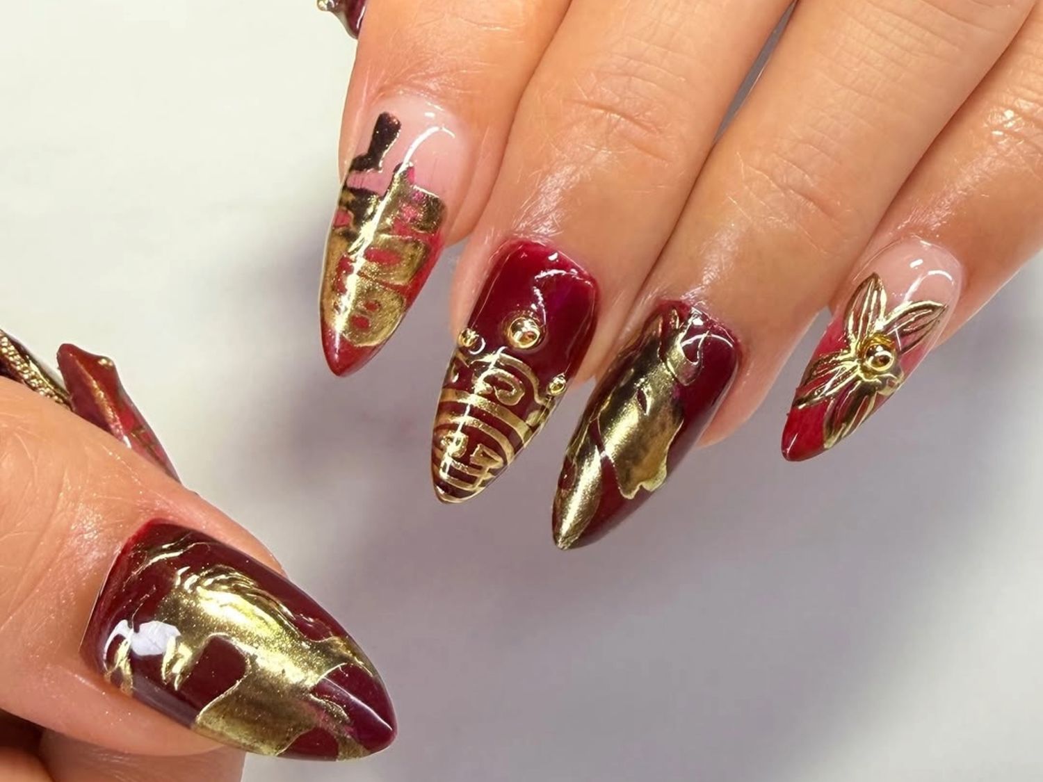 Deep Red Gold Foil and Embellishment Almonds Deep Red Gold Foil and Embellishment Almonds — Long Almond Nails 2027