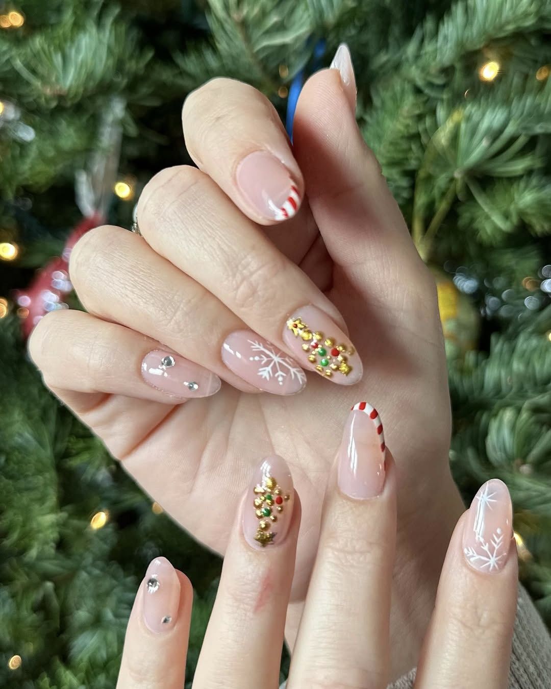 Sheer Pink Candy Cane Snowflake Oval Nails Sheer Pink Candy Cane Snowflake Oval Nails — Neutral Christmas Nails 2026