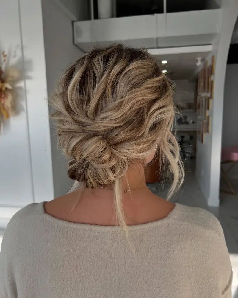Textured Messy Low Bun With Face-Framing Pieces Textured Messy Low Bun With Face-Framing Pieces — Summer Updos 2027