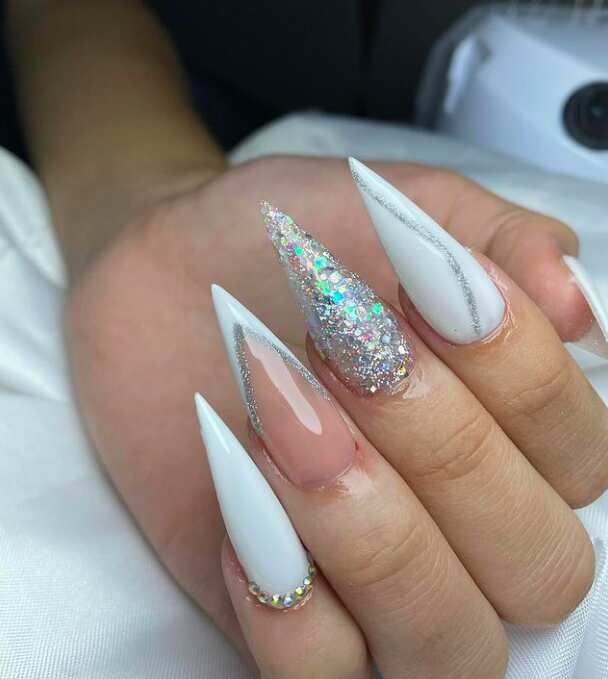 Visual Idea — The Hand Is Posed Against A White Visual Idea — The Hand Is Posed Against A White — Silver New Years Nails 2027