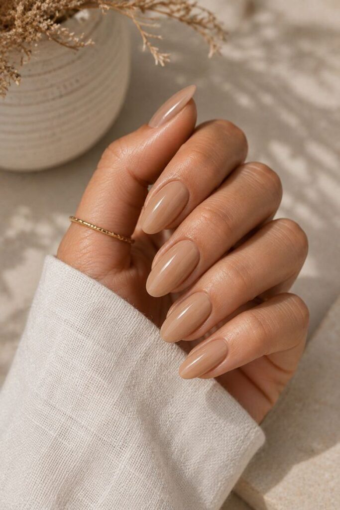 Warm Beige Nude Glossy Medium Oval Nails Warm Beige Nude Glossy Medium Oval Nails — Nude Nails 2027 for Mature Hands