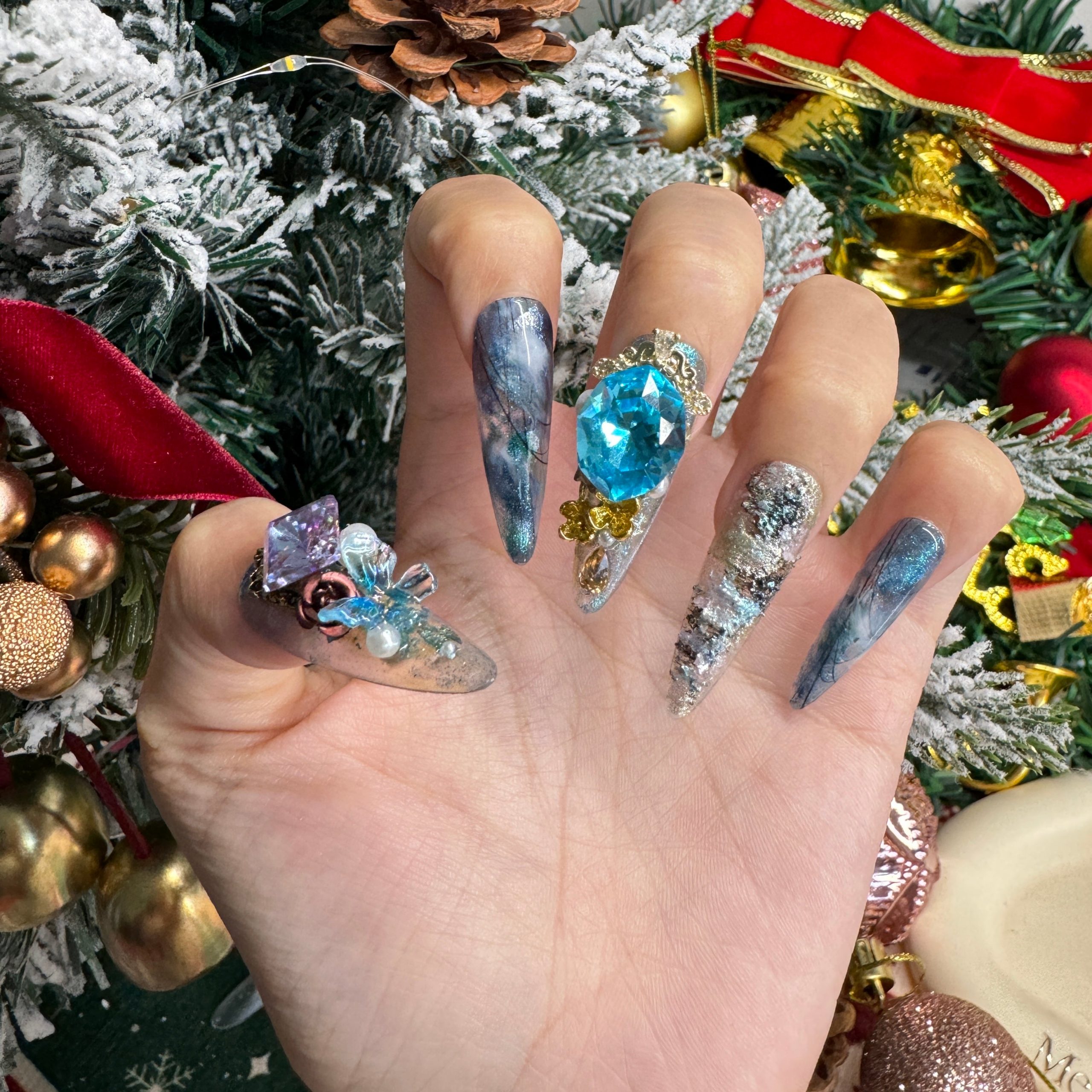 Extra-Long Stiletto Gemstone and Marble Nails Extra-Long Stiletto Gemstone and Marble Nails — Blue Christmas Nails 2026