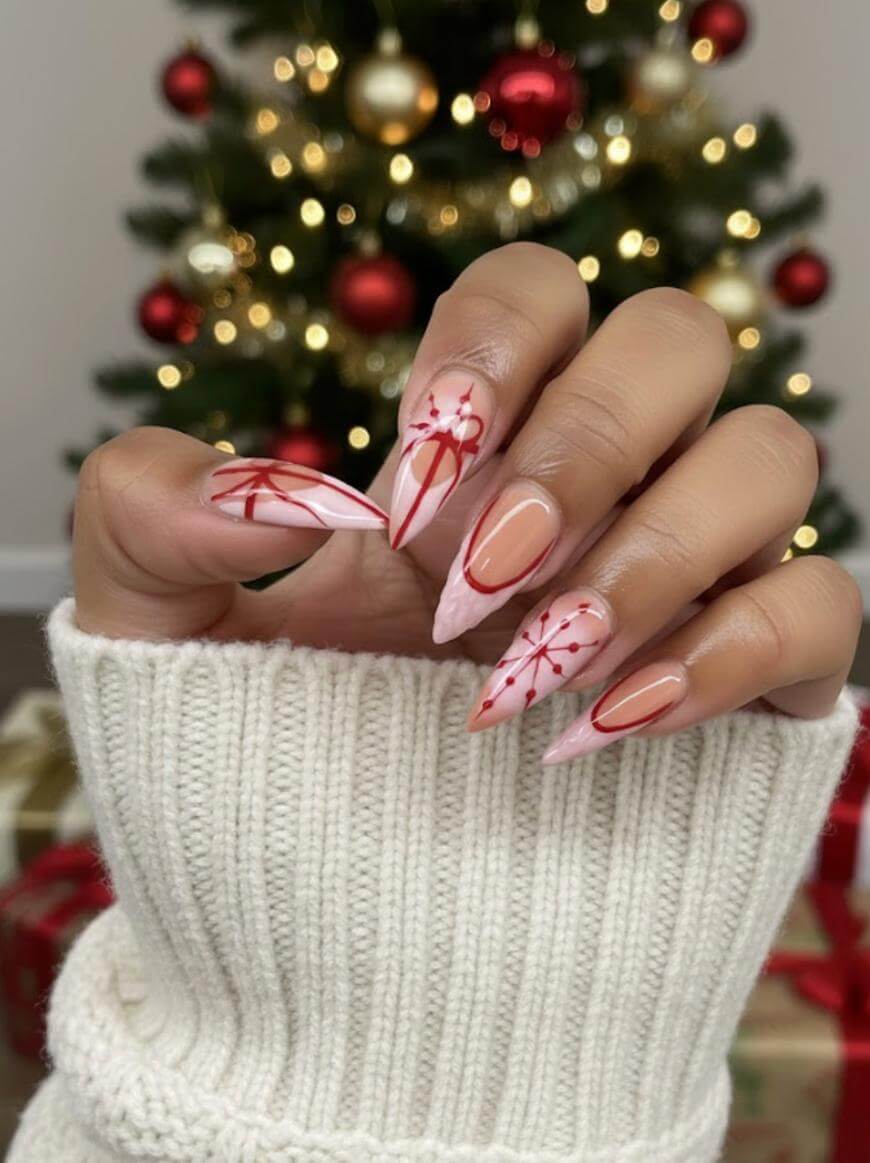Nude Stiletto with Red Ribbon Bows — Long Christmas Nails 2026