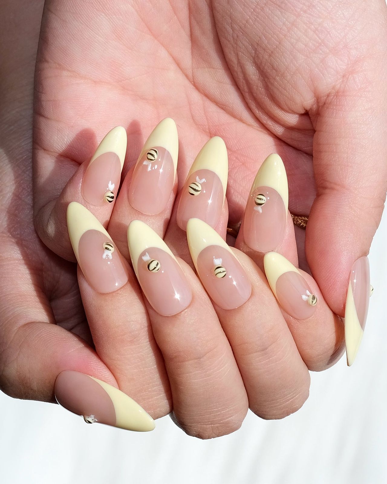 Long Almond French with Gold Bee Charms Long Almond French with Gold Bee Charms — Bee Nails 2027