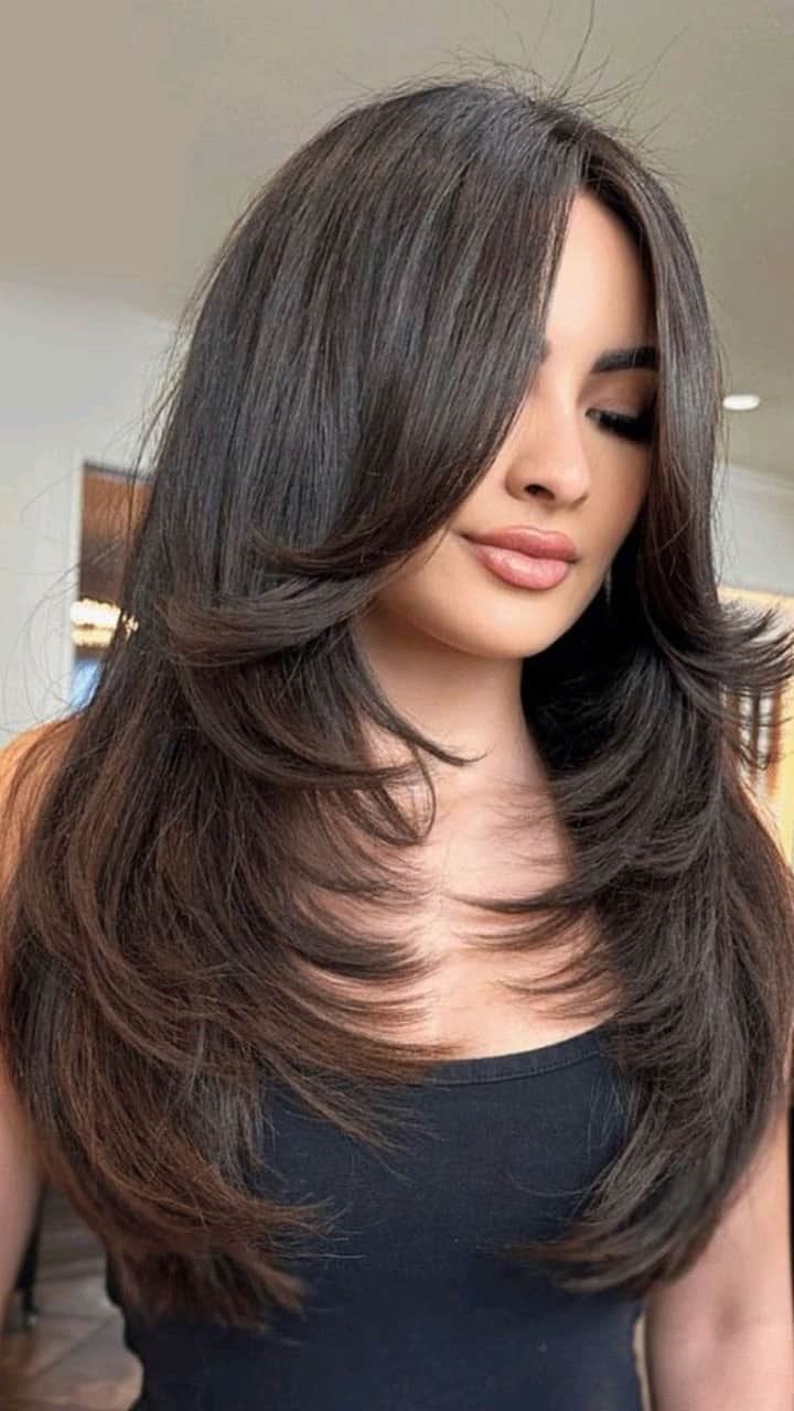 Mid-Back Layered Cut With Side-Swept Bangs Mid-Back Layered Cut With Side-Swept Bangs — Trendy Haircuts 2027